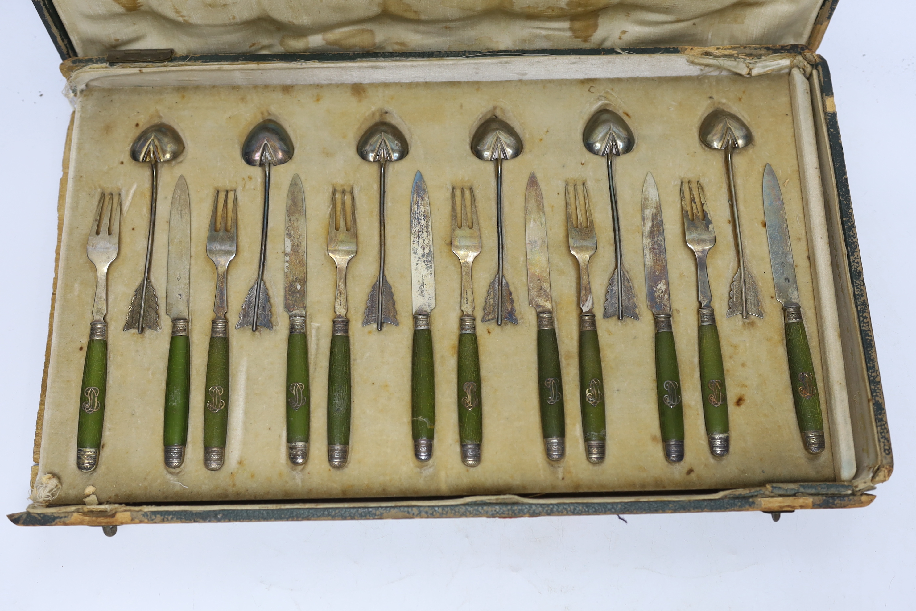 A cased French thirty six piece dessert set, comprising twelve white metal spoons and twelve pairs of phenolic handled white metal dessert eaters, all by Robert Linzeler, knife 15.5cm.